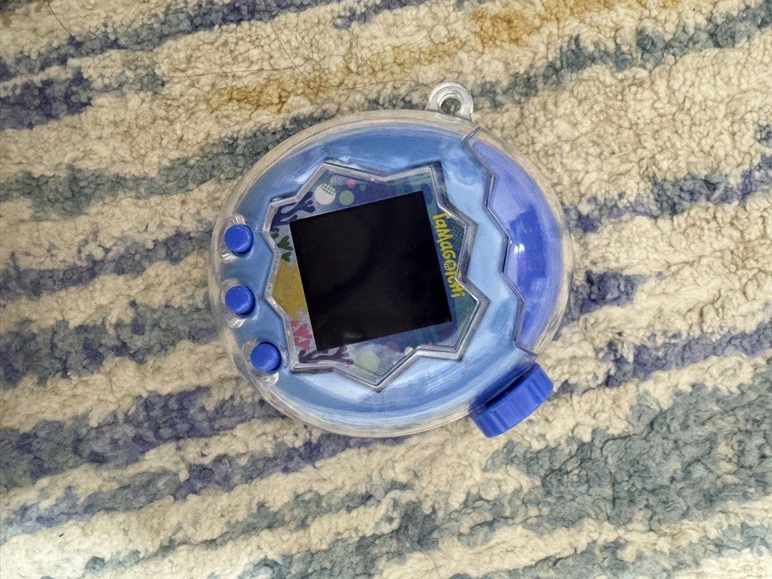 Tamagotchi Paradise Blue Water (Category: Interactive Toys) located in Manila. Submitted by blueberriri (Listing ID 1471019744, Image 3). Description: Rarely used. Bought Oct 3 No issues, with clear case and screen protector.