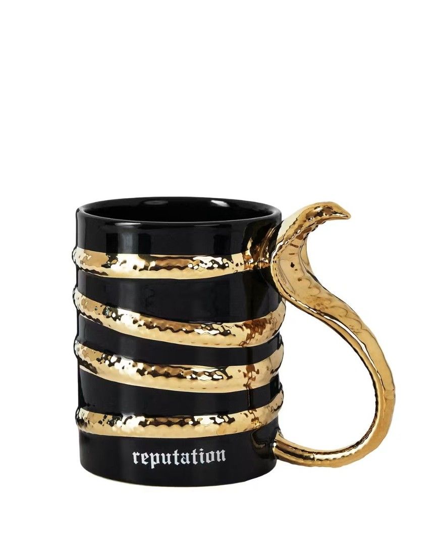 Taylor Swift Reputation Snake Mug Black Gold (Category: Western Merchandise) located in Quezon City. Submitted by yumianya23 (Listing ID 1470943188, Image 1). Description: Perfect for Swifties and coffee lovers alike! Never been used and still Brand new with Box Bought it for 3,800 but selling it for only 3k :) Can provide Proof of Purchase!.