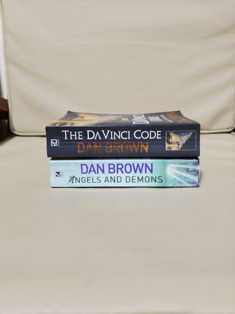 The Da Vinci Code & Angels and Demons by Dan Brown (Category: Storybooks) located in Antipolo. Submitted by chapchae (Listing ID 1471078334, Image 1). Description: - Set of 2 Dan Brown paperback thrillers: The Da Vinci Code and Angels & Demons - Pages have a vintage yellowed tint from age - Covers show minor shelf wear and edge curling - Great budget-friendly bundle for thriller fans - Set for 170.