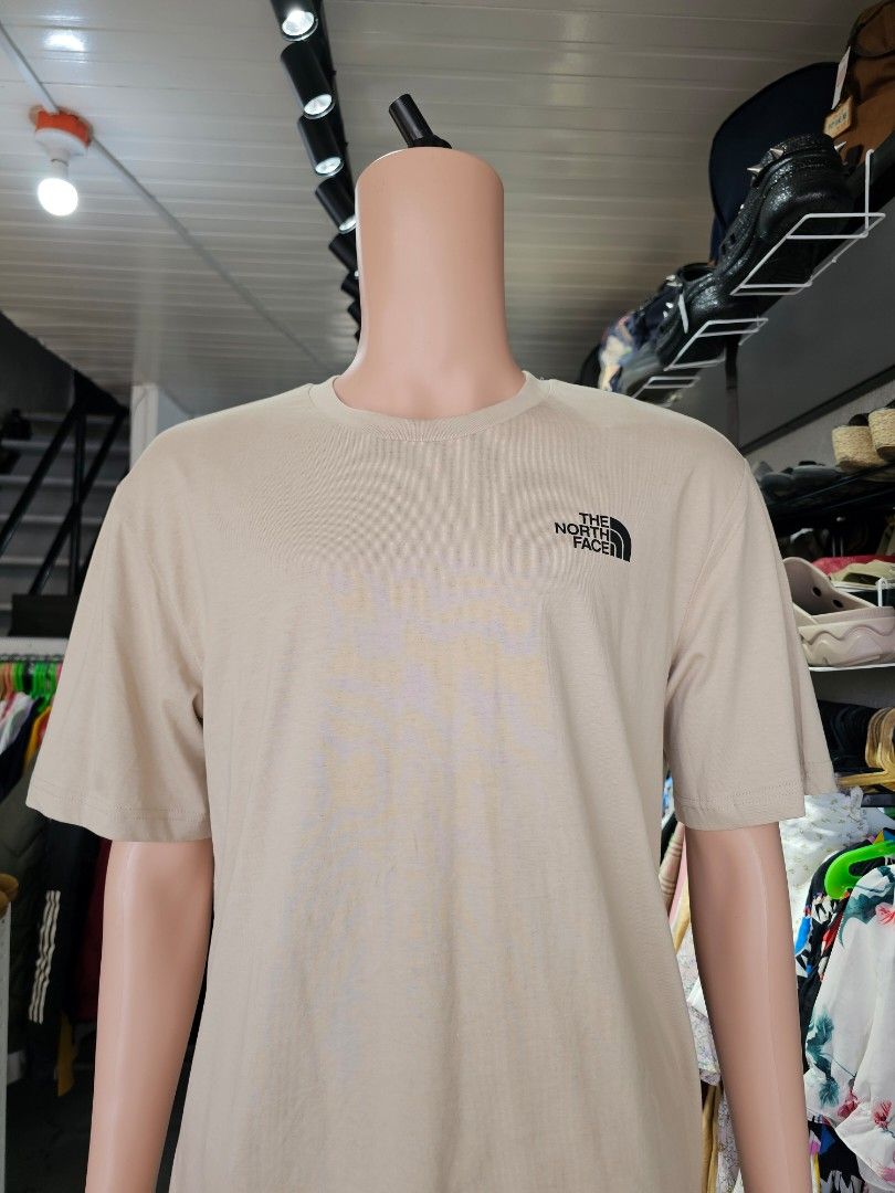 The North Face Simple Dome T-Shirt (Category: Tshirts & Polo Shirts ) located in Baguio. Submitted by kayeonlineshop (Listing ID 1471025818, Image 2). Description: beige The North Face Simple Dome T-Shirt featuring a crew neck and a small black brand logo on the left chest..