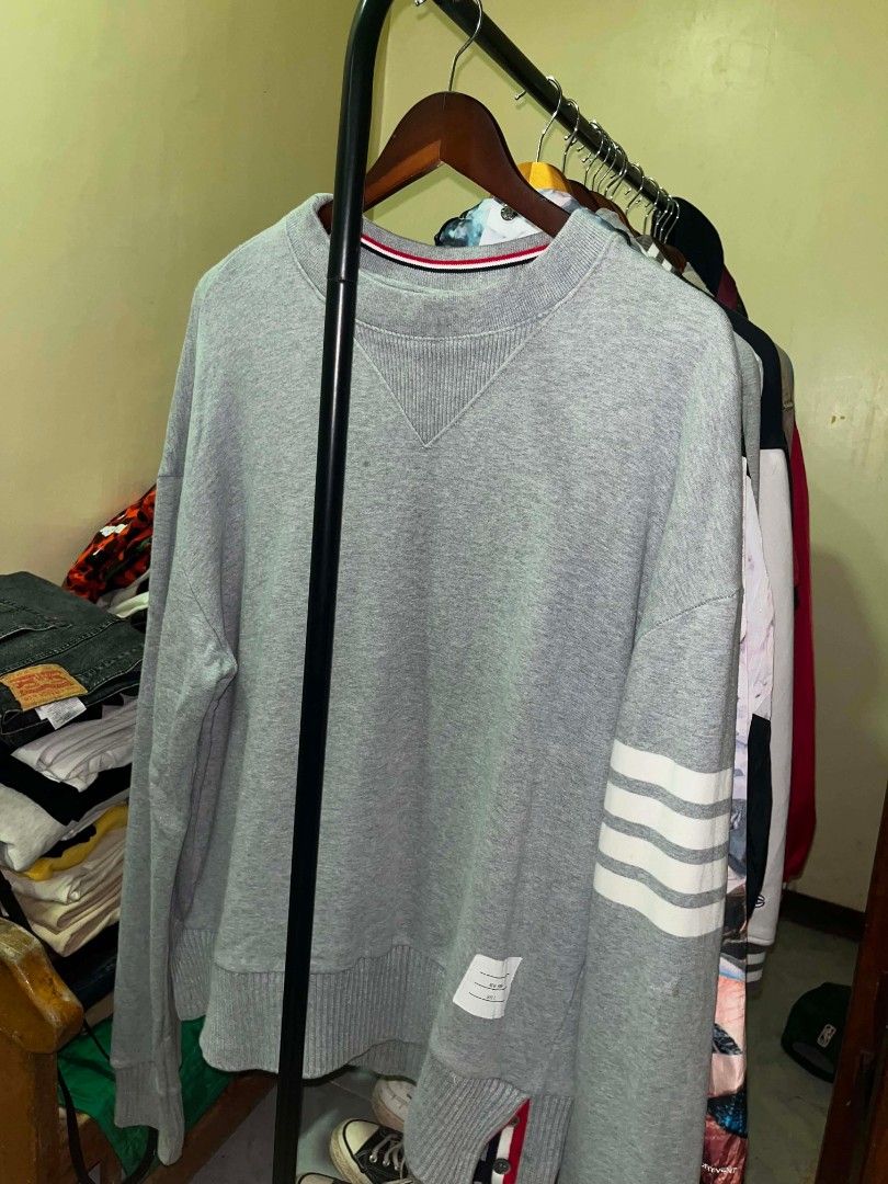 Thom Browne Grey 4-Bar Sweatshirt Size 2 (Category: Coats, Jackets and Outerwear) located in Tuguegarao City. Submitted by ZeevLim (Listing ID 1470936411, Image 1). Description: - Brand: Thom Browne - Item: Classic Crewneck Sweatshirt - Color: Grey - Size: 2 but xl - Material: Soft cotton loopback jersey (Made in Italy) - Key Features: Signature 4-white engineered stripes on left sleeve, ribbed V-inset with tricolor tipping, woven size label patc
