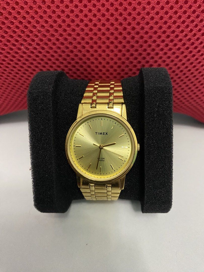 Timex Gold Tone Watch TW00A3043-AA (Category: Women's Watches) located in Baguio. Submitted by masterroller (Listing ID 1470970059, Image 1). Description: - Brand/Model: Timex Gold-Tone Watch (TW00A3043-AA) - Dial: Sunburst gold with clean stick markers - Strap: Matching gold-tone metal link bracelet with secure clasp - Specs: Stainless steel back, 30 meters water resistance - Movement: Battery-powered quartz movement, runs smoothly - Style: Clas