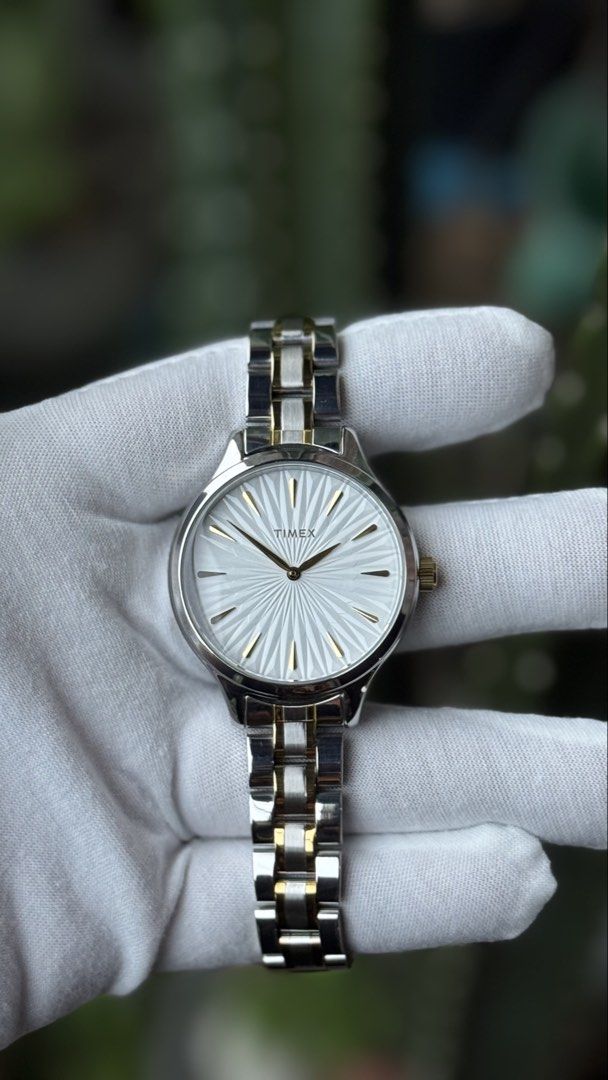 Timex Two-Tone Watch TW2V06500 (Category: Women's Watches) located in Manila. Submitted by junjun12356 (Listing ID 1471074935, Image 1). Description: - Brand: Timex - Style: Two-tone women's watch (silver and gold bracelet links) - Dial: Textured white sunburst dial with elegant gold-tone markers and crown - Movement: Reliable quartz movement, keeps time properly - Condition: Excellent, with protective plastic wrapping still on parts of the clasp