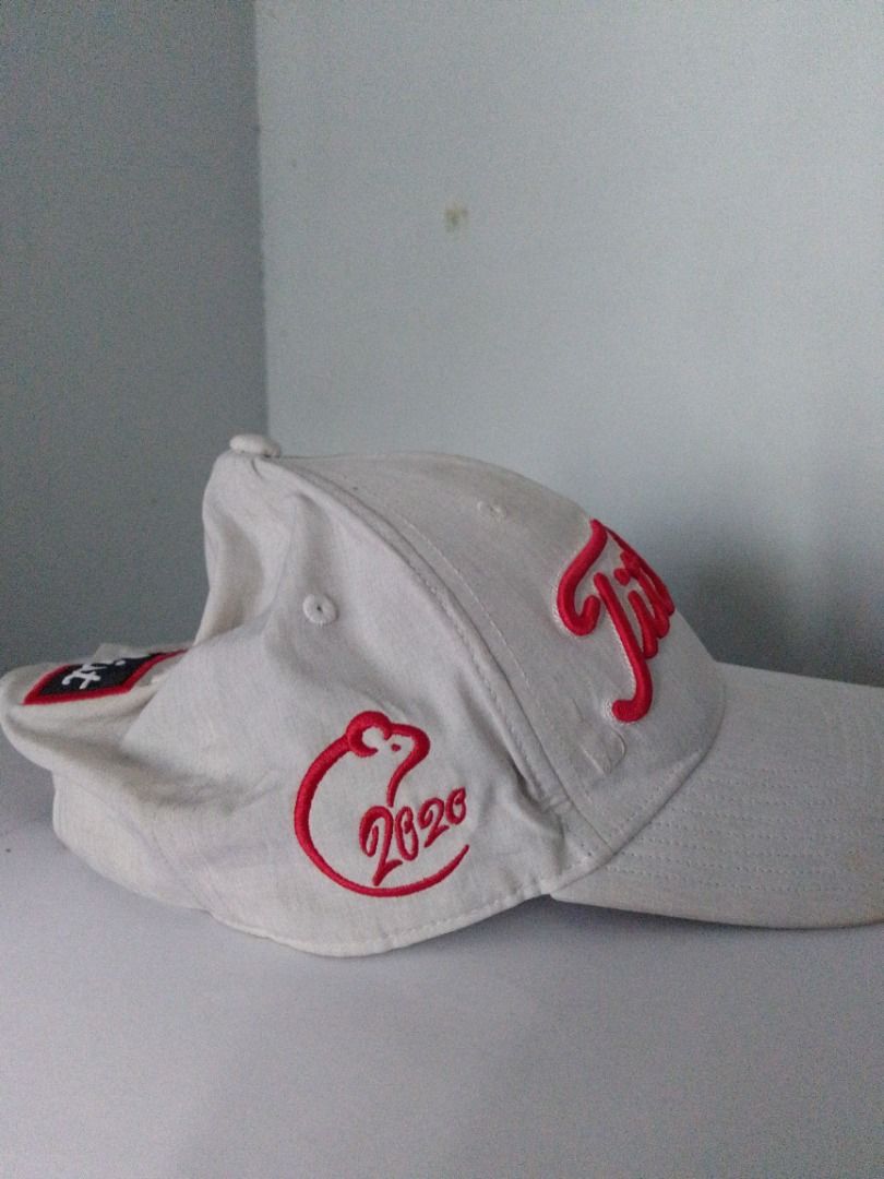 Titleist 2020 Pro V1 Golf Hat White Red (Category: Caps & Hats) located in Pavia. Submitted by ilawod_shop (Listing ID 1470967832, Image 3). Description: - Authentic Titleist golf cap in classic white - Eye-catching red embroidered lettering on front, right side, and back strap - Pro V1 printed on the left side - Unique 2020 graphic with a rat symbol on the side - Adjustable strap closure for a customized, secure fit - Built-in interior sweatband
