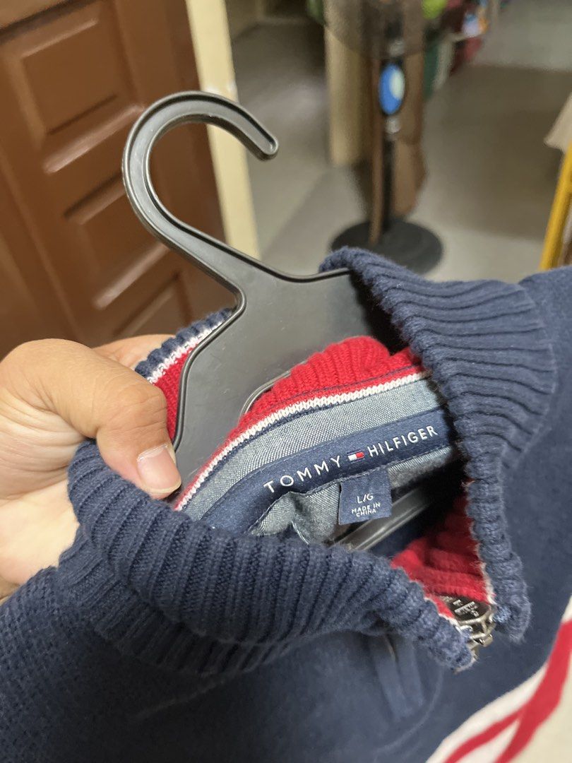 Tommy Hilfiger 1/4 Zip Colourblock Sweater (Category: Coats, Jackets and Outerwear) located in Quezon City. Submitted by reluxefinds2025 (Listing ID 1470991685, Image 2). Description: - Brand: Tommy Hilfiger - Style: Quarter-zip colourblock sweater - Colors: Navy, white, and red - Size: Large - Material: Thick, warm knit with ribbed cuffs and hem - Condition: Excellent, classic sporty look.