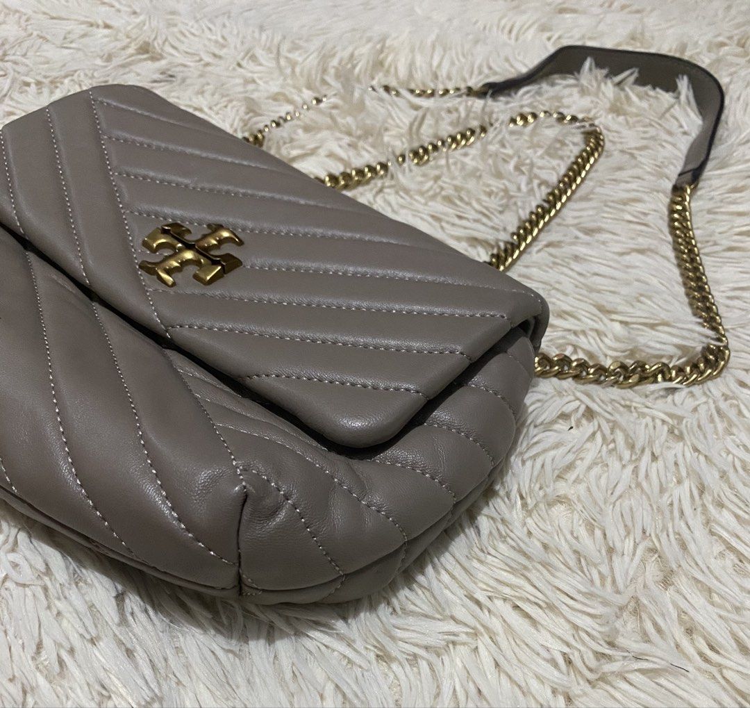 Tory Burch sheepskin Leather Bag (Category: Luxury Bags & Wallets) located in Manila. Submitted by switchcity (Listing ID 1471110652, Image 3). Description: - Brand: Tory Burch - Material: Premium gray quilted leather with chevron stitching - Hardware: Gold-tone double T logo and chain strap with leather shoulder guard - Closure: Secure front flap closure - Design: Soft structure with clean, elegant stitching - Size: Compact daily size, perfect f
