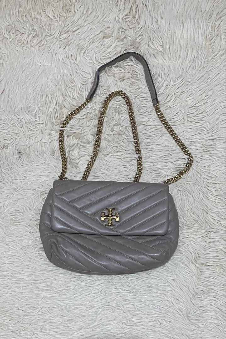 Tory Burch sheepskin Leather Bag (Category: Luxury Bags & Wallets) located in Manila. Submitted by switchcity (Listing ID 1471110652, Image 1). Description: - Brand: Tory Burch - Material: Premium gray quilted leather with chevron stitching - Hardware: Gold-tone double T logo and chain strap with leather shoulder guard - Closure: Secure front flap closure - Design: Soft structure with clean, elegant stitching - Size: Compact daily size, perfect f