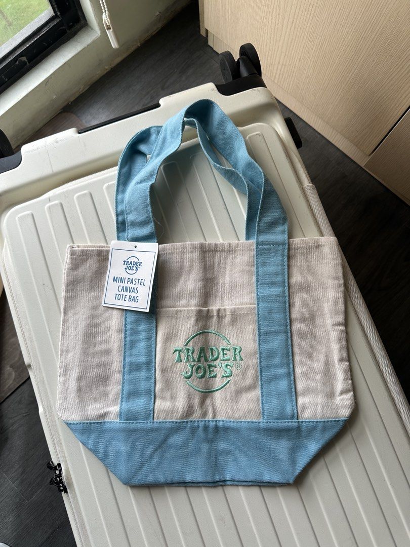Trader Joe's canvas tote bag (Category: Tote Bags) located in San Pedro. Submitted by hallyuniverseshop (Listing ID 1471015699, Image 2). Description: Pastel blue #1 Black #1 Orange #1 (Brandnew, No tag).