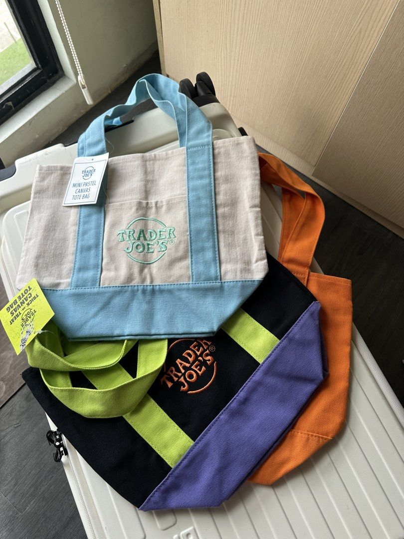 Trader Joe's canvas tote bag (Category: Tote Bags) located in San Pedro. Submitted by hallyuniverseshop (Listing ID 1471015699, Image 1). Description: Pastel blue #1 Black #1 Orange #1 (Brandnew, No tag).