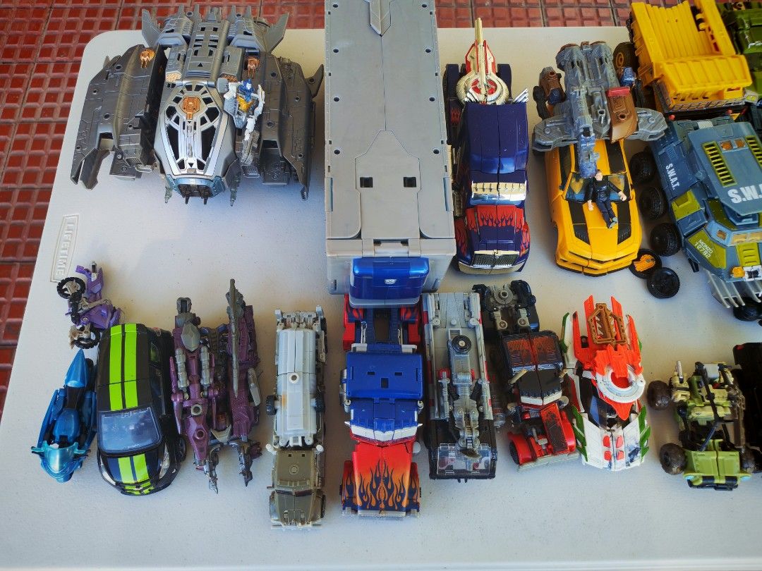 TRANSFORMERS LOT TAKE ALL (PWEDE BREAK SET) (Category: Action & Battle Toys) located in Manila. Submitted by vintage_aniks (Listing ID 1471009713, Image 2). Description: TRANSFORMERS LOT TAKE ALL Lf: Collector ng Transformers or old figures PM nalang for your offer and/or issues ng mga figures Around 35+ figs on the table, plus junk/extra parts from 15+ figures inside the box Mix of Hasbro, Takara Tomy, Kre-O, and Construct-Bots. All figures are 