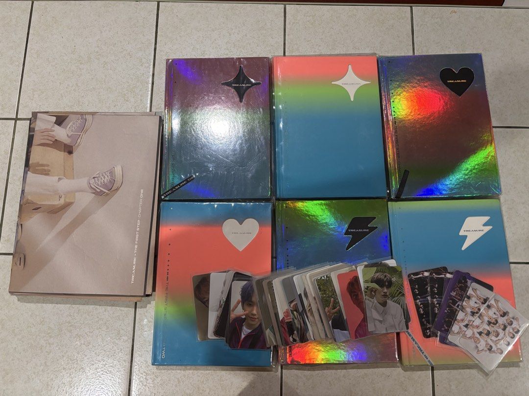TREASURE The First Step Album Collection with Photocards (Category: CDs & DVDs) located in San Jose. Submitted by gee_06 (Listing ID 1471058718, Image 1). Description: Negotiable +Shipping fee - Full set of TREASURE 'The First Step' album series - Includes multiple versions with holographic covers & outer sleeves - Complete with photobooks and a large stack of member photocards - Pristine condition, kept securely in protective sleeves - Perfect a