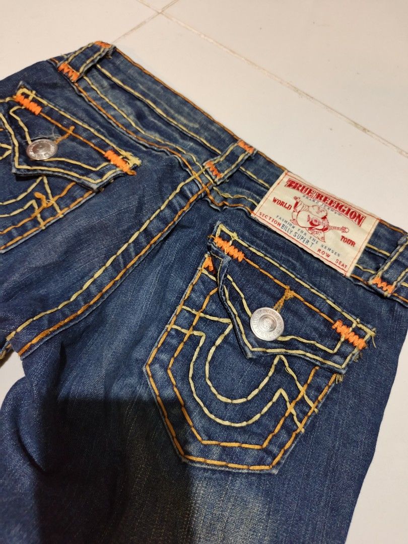 True Religion Billy Super T Jeans Size 27 (Category: Jeans) located in Davao. Submitted by romelyap (Listing ID 1471005059, Image 3). Description: - Brand/Model: True Religion Billy Super T Jeans - Wash: Dark blue wash - Size: Waist 27 - Details: Signature thick orange & white contrast stitching, button-flap back pockets - Fit: Straight legs, classic denim styling - Origin: Made in USA.