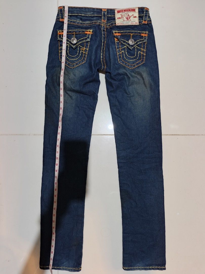 True Religion Billy Super T Jeans Size 27 (Category: Jeans) located in Davao. Submitted by romelyap (Listing ID 1471005059, Image 1). Description: - Brand/Model: True Religion Billy Super T Jeans - Wash: Dark blue wash - Size: Waist 27 - Details: Signature thick orange & white contrast stitching, button-flap back pockets - Fit: Straight legs, classic denim styling - Origin: Made in USA.