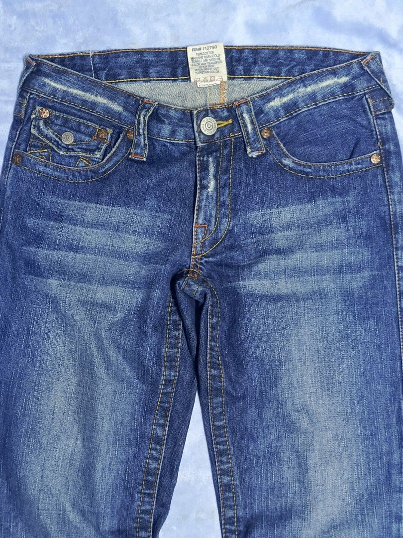 True Religion Section 503 Flared Jeans (Category: Jeans) located in City of Isabela. Submitted by warmbird.d06e6f (Listing ID 1470946031, Image 2). Description: - Brand: True Religion - Style: Flared leg cut with contrast paneling and mid-rise waist - Color: Dark blue wash - Pockets: Signature button-flap back pockets and front pockets with miniature watch pocket detail - Details: Classic Buddha brand patch on back waistband, RN 112790 tag inside