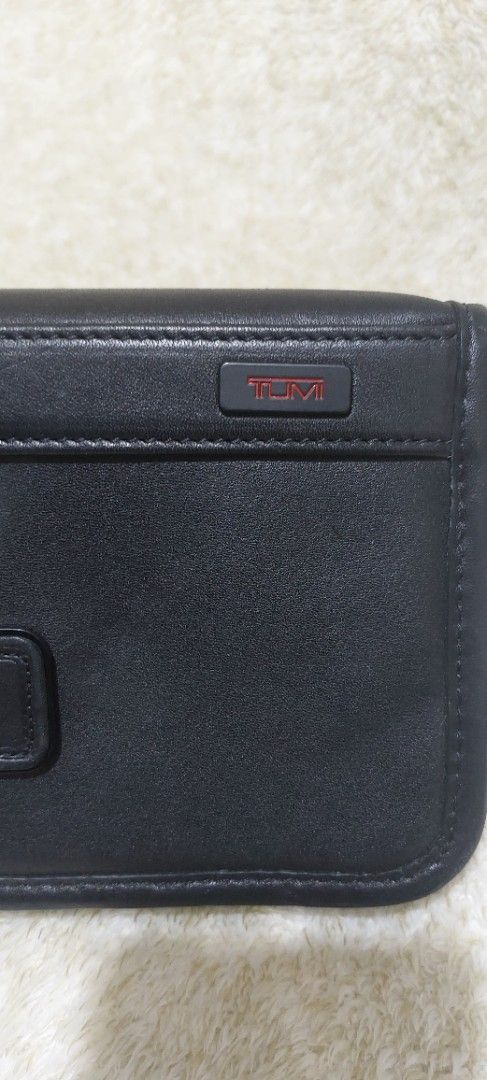 Tumi Leather Clutch Wrislet Bag (Category: Luxury Bags & Wallets) located in Davao. Submitted by wengbagstuff (Listing ID 1471081403, Image 2). Description: ✅️ no issues, in very good condition ✅️ no rubs, no open pipes ✅️ 💯✔️ - Features: Attached side wrist strap and secure zip closure - Interior: Fabric-lined with multiple card slots and zip compartments - with Tumi metal logo on front and Tumi tracer metal plate inside (Style 92113DH) - Condi