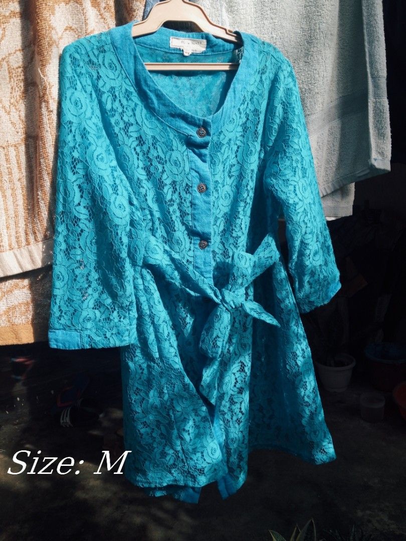Turquoise Lace Dress with Waist Tie (Category: Dresses) located in Naga. Submitted by francethriftee3 (Listing ID 1471054607, Image 1). Description: Location:Camarines Sur, Bicol - Color: Bright turquoise - Size: Medium (M) - Material: Lightweight floral lace - Design: Button-up front with top buttons & 3/4 sleeves - Includes: Matching fabric tie belt to cinch the waist - Condition: Excellent.