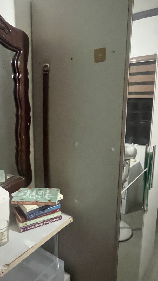 Two door wardrobe with full length mirror (Category: Shelves, Cabinets & Racks) located in Talavera. Submitted by dnms_ (Listing ID 1471028251, Image 2). Description: - Color & Material: Light grey wood with sturdy construction - Door Left: Features an attached full-length mirror - Door Right: Fitted with sleek, long vertical silver handles - Interior Storage: Spacious hanging area, multiple shelves, and a convenient middle pullout drawer - Condi