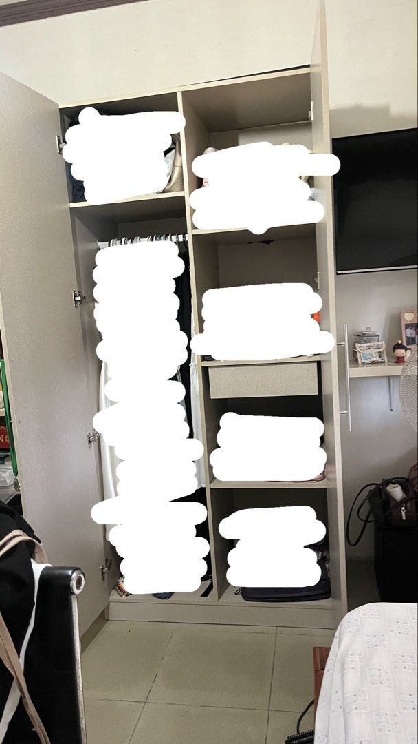 Two door wardrobe with full length mirror (Category: Shelves, Cabinets & Racks) located in Talavera. Submitted by dnms_ (Listing ID 1471028251, Image 3). Description: - Color & Material: Light grey wood with sturdy construction - Door Left: Features an attached full-length mirror - Door Right: Fitted with sleek, long vertical silver handles - Interior Storage: Spacious hanging area, multiple shelves, and a convenient middle pullout drawer - Condi