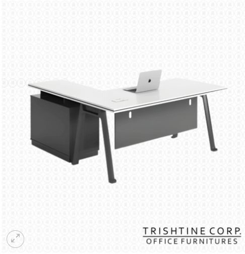 TXT-027 | Modern Executive L-Shape Table (Category: Office Furniture & Fixtures) located in Caloocan City. Submitted by jim.trishtineofficefurnitures (Listing ID 1471018079, Image 1). Description: - Design: Modern L-shaped office desk in a stylish white and dark grey finish - Storage: Built-in side storage cabinet underneath to keep your workspace clutter-free - Features: Front modesty panel for privacy and trendy angled metal legs - Surface: Spa