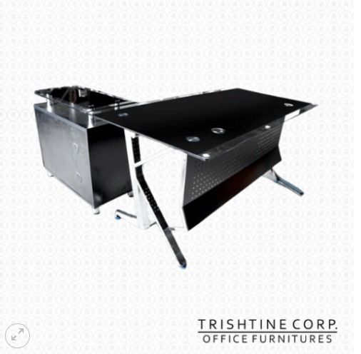 TXT-049 | Glass Executive Table (Category: Office Furniture & Fixtures) located in Caloocan City. Submitted by jim.trishtineofficefurnitures (Listing ID 1471014141, Image 1). Description: - Brand/Maker: Trishtine Corp Office Furniture - Surface: Sleek black glass top with cable management grommets - Frame & Design: Durable metal frame with a stylish perforated modesty panel - Storage: Includes a matching side storage cabinet - Build: Heavy-duty c