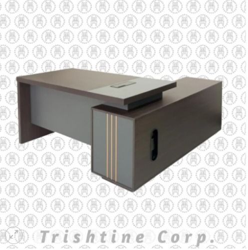TXT-090 | Modern L-shape Executive Table (Category: Office Furniture & Fixtures) located in Caloocan City. Submitted by jim.trishtineofficefurnitures (Listing ID 1471000436, Image 1). Description: - Premium executive desk for home offices or corporate workspaces - Modern wood grain finish paired with sleek grey panels - Built-in side return cabinet featuring stylish vertical gold stripe accents and handle - Integrated cable management panel keeps