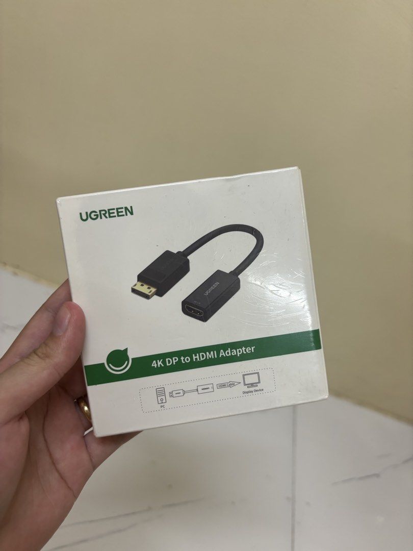 UGREEN 4K DisplayPort to HDMI Adapter (Category: Cables & Adaptors) located in Manila. Submitted by vegajhasse57128 (Listing ID 1471038639, Image 1). Description: - Brand: UGREEN (Model 40363) - Resolution: Up to 4K at 30Hz - Audio: Uncompressed LPCM audio supported - Specs: 300MHz bandwidth, 25cm total length - Ports: DisplayPort (Male) to HDMI (Female) - Condition: Brand new in original packaging with manual.