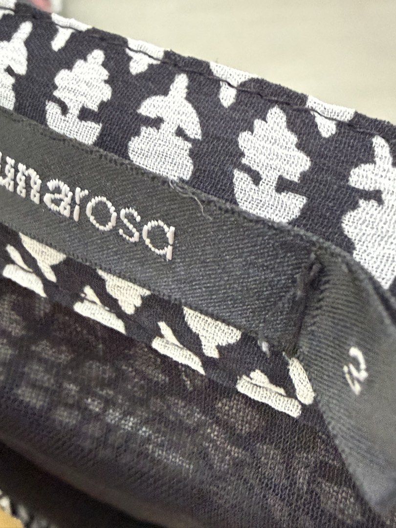 Umarosa Black and White Patterned Maxi Skirt Size 3 (Category: Skirts) located in Quezon City. Submitted by reivia.vend (Listing ID 1471018684, Image 2). Description: - Brand/Style: Umarosa black and white maxi skirt - Design: All-over geometric print with a wide floral hem border - Fit & Comfort: Easy pull-on fit with an elastic waistband - Material: Lightweight sheer fabric with built-in lining for coverage - Size: Tagged Size 3 - Condition: Gr