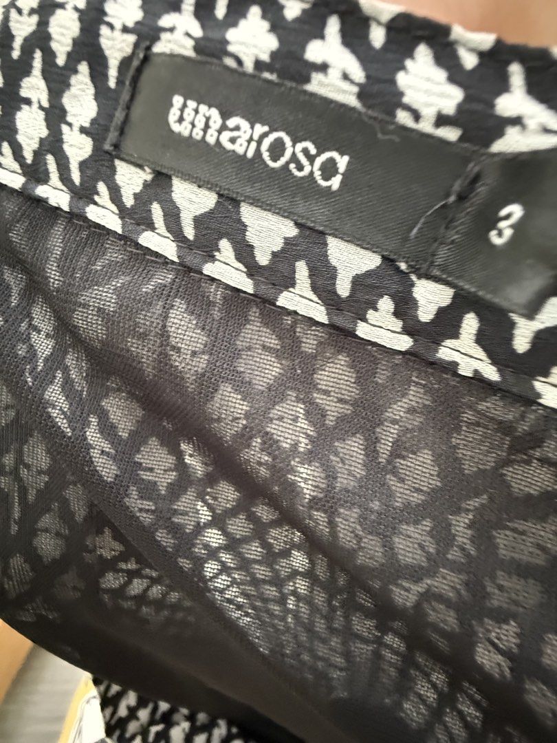 Umarosa Black and White Patterned Maxi Skirt Size 3 (Category: Skirts) located in Quezon City. Submitted by reivia.vend (Listing ID 1471018684, Image 3). Description: - Brand/Style: Umarosa black and white maxi skirt - Design: All-over geometric print with a wide floral hem border - Fit & Comfort: Easy pull-on fit with an elastic waistband - Material: Lightweight sheer fabric with built-in lining for coverage - Size: Tagged Size 3 - Condition: Gr