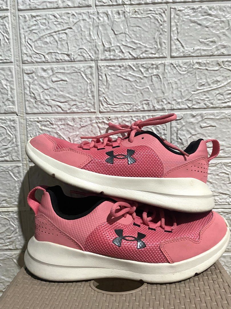 Under Armour Pink Sneakers (Category: Sneakers) located in San Pedro. Submitted by meimeow_0012 (Listing ID 1471093690, Image 2). Description: - Brand: Under Armour - Color: Bright pink with white soles and black lining - Material: Breathable mesh upper to keep feet cool - Comfort: Cushioned interior with UA logo on insoles - Features: Easy pull-on heel tabs and secure lace-up closure - Condition: Minimal wear on soles, excellent pre-loved condit