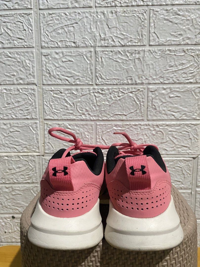 Under Armour Pink Sneakers (Category: Sneakers) located in San Pedro. Submitted by meimeow_0012 (Listing ID 1471093690, Image 3). Description: - Brand: Under Armour - Color: Bright pink with white soles and black lining - Material: Breathable mesh upper to keep feet cool - Comfort: Cushioned interior with UA logo on insoles - Features: Easy pull-on heel tabs and secure lace-up closure - Condition: Minimal wear on soles, excellent pre-loved condit