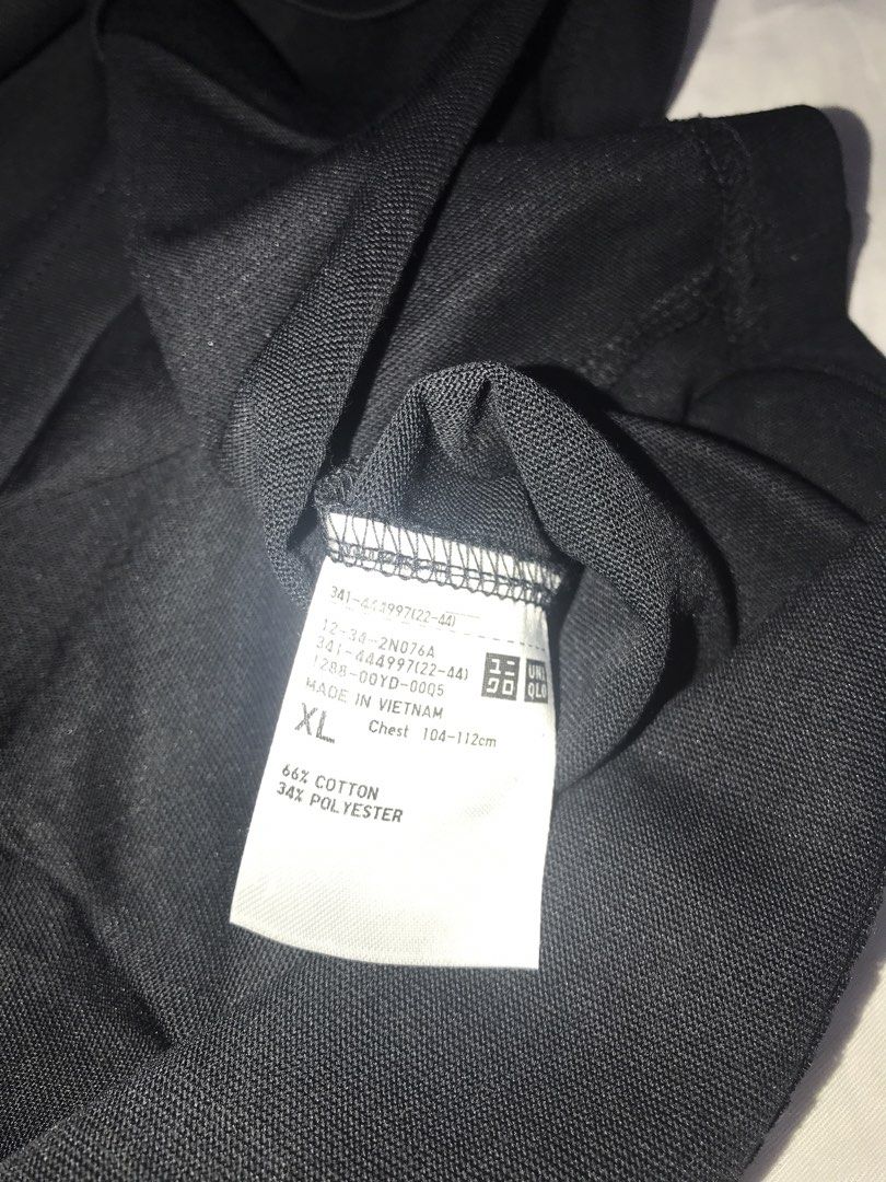 Uniqlo Black T-Shirt XL (Category: Shirts) located in Pasig City. Submitted by papotzy (Listing ID 1471086621, Image 3). Description: - Brand: Uniqlo - Color: Solid Black - Size: XL (Chest: 104-112cm) - Material: 66% Cotton, 34% Polyester - Style: Crew neck, short sleeve - Condition: Brand new with original hang tag attached - Origin: Made in Vietnam.