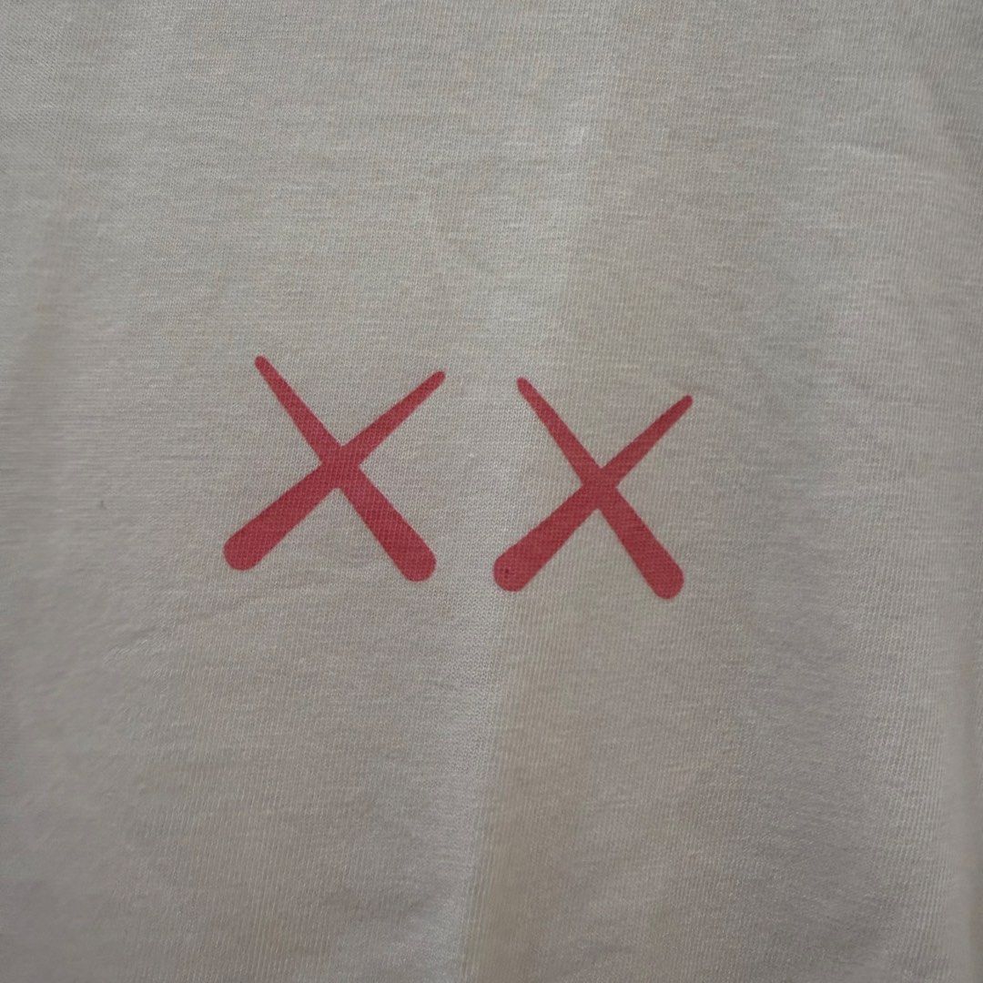 Uniqlo UT x KAWS White Tee Size S (Category: Shirts) located in Las Pinas. Submitted by lovelyfinds. (Listing ID 1471007228, Image 2). Description: .