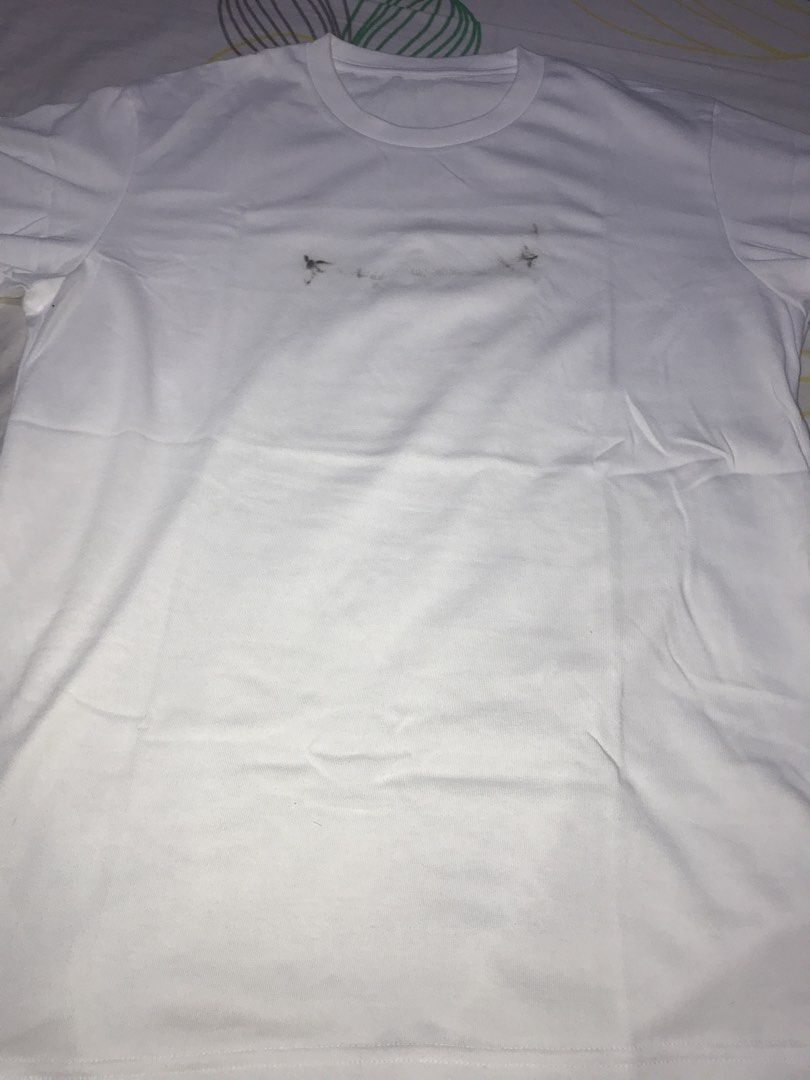 Uniqlo White T-Shirt Size M (Category: Tshirts & Polo Shirts ) located in Pasig City. Submitted by papotzy (Listing ID 1471088862, Image 1). Description: - Brand: Uniqlo - Color: White - Style: Crew neck t-shirt - Size: M (fits chest 88-96 cm) - Material: 66% cotton, 34% polyester - Condition: Brand new with original tags attached - Flaw: Has a faint faded graphic or stain mark across the chest area With stain.