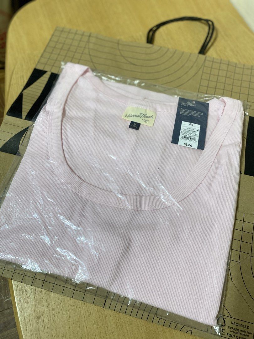Universal Thread Light Pink Ribbed Tank Top 4X (Category: Sleeveless) located in Batangas. Submitted by lux_kimmy (Listing ID 1470965989, Image 2). Description: - Brand: Universal Thread - Style: Ribbed tank top with scoop neck - Color: Light Pink - Size: 4X - Condition: Brand new with tags (NWT), still in original plastic packaging - Material: Soft and comfortable knit fabric.