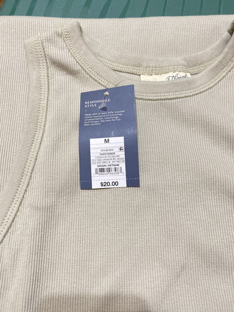 Universal Thread Ribbed Tank Dress Taupe Size M (Category: Dresses) located in Batangas. Submitted by lux_kimmy (Listing ID 1470968574, Image 3). Description: - Brand: Universal Thread - Style: Ribbed tank midi dress - Color: Taupe - Size: Medium - Neckline: Crew neck - Details: Sleeveless, made with at least 20% recycled cotton - Condition: Brand new with retail tag attached (Original Price: $20).