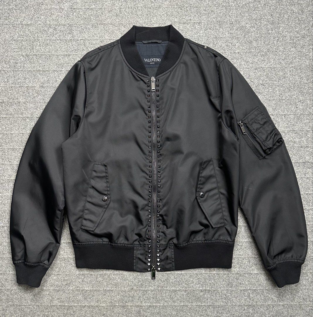 Valentino - Rockstud Blouson Bomber Jacket (Category: Coats, Jackets and Outerwear) located in Manila. Submitted by scissor.2fifthy (Listing ID 1470939546, Image 1). Description: Valentino - Rockstud Blouson Bomber Jacket Size: 54 (see measurement) Made in Italy Material: 100% Polyamide 90/100 condition rate Gently used Flaw: Minor sign of usage only Very presentable Check all photos for more details and information Dimensions Length 27 Inches Wi