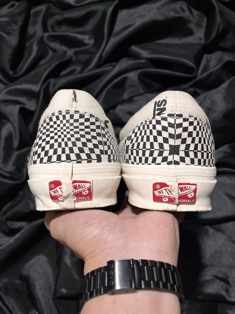 Vans Checkerboard Optical Illusion Slip-On Vault (Category: Sneakers) located in Consolacion. Submitted by archerowar_20 (Listing ID 1471093959, Image 3). Description: Vans slip-on sneakers with black and white optical illusion checkerboard pattern all over the canvas upper. Classic off-white vulcanized rubber midsole and waffle gum rubber outsoles. 'Off The Wall Originals' red branding on the heels. Slip-on design with elastic side accents. Clea