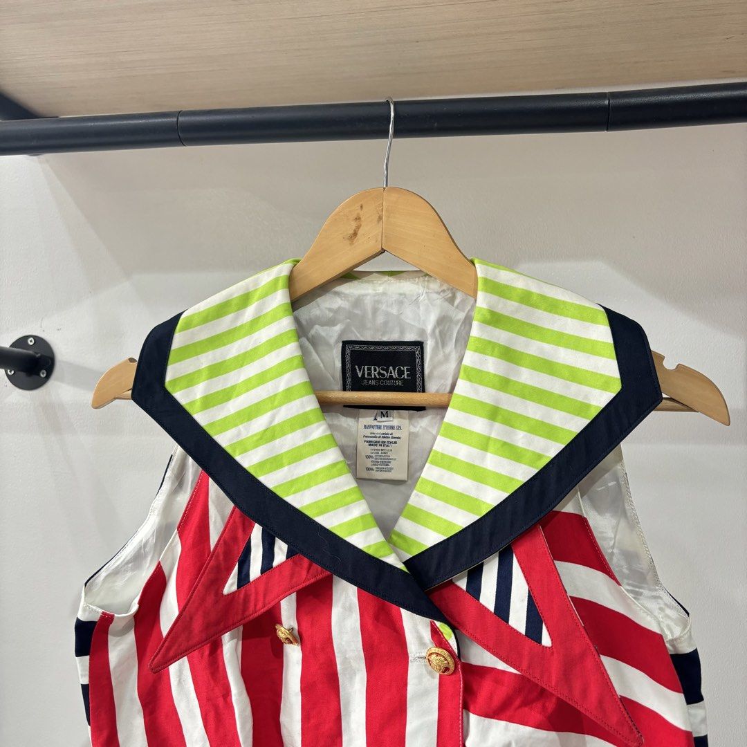 Versace Jeans Couture Multicolour Striped Sailor Vest (Category: Blouses) located in Bambang. Submitted by heats777 (Listing ID 1471038428, Image 1). Description: - Brand: Versace Jeans Couture - Size: M - Design: Bold multicolour with red/white diagonal stripes on front, navy/white horizontal stripes on back, and neon green/navy collar - Details: Double-breasted front with gold-tone branded buttons - Material: 100% cotton outer, 100% rayon linin