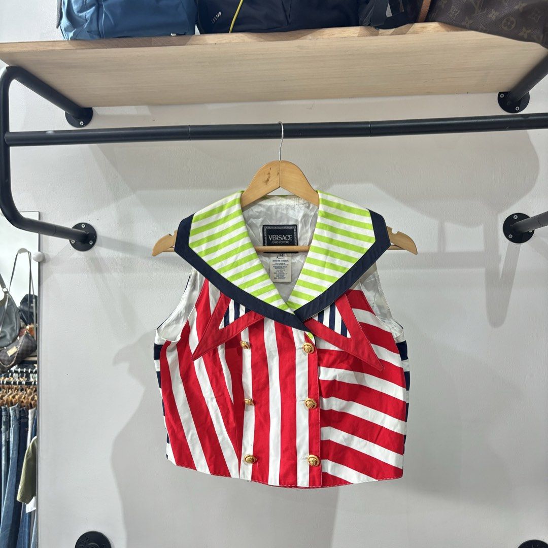 Versace Jeans Couture Multicolour Striped Sailor Vest (Category: Blouses) located in Bambang. Submitted by heats777 (Listing ID 1471038428, Image 2). Description: - Brand: Versace Jeans Couture - Size: M - Design: Bold multicolour with red/white diagonal stripes on front, navy/white horizontal stripes on back, and neon green/navy collar - Details: Double-breasted front with gold-tone branded buttons - Material: 100% cotton outer, 100% rayon linin