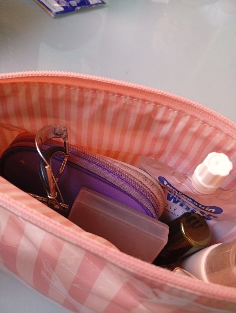 Victoria's Secret makeup pouch (Category: Purses & Pouches) located in Quezon City. Submitted by purple_haven (Listing ID 1470998284, Image 3). Description: auth Victoria's Secret makeup pouch iconic pink and white stripes with mini padlock chain design zipper well used with little stain outside.