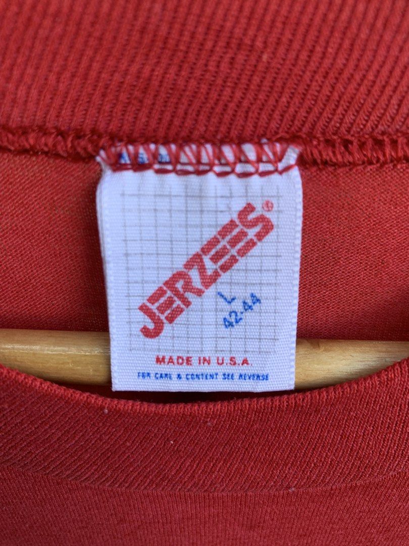 Vintage 1980s Jerzees blank tee (Category: Tshirts & Polo Shirts ) located in Cagayan de Oro. Submitted by premium_thrifts (Listing ID 1471030096, Image 2). Description: Red colorway. Good condition. Single stitch on sleeves and double on hem Fits Large L26.8" x W21" 18" (shoulder to shoulder) 8.5" (sleeve length) Issue: has fades, bleach stain spots, small holes on both armpit, and lints Add shipping fee (via JRS or J&T).