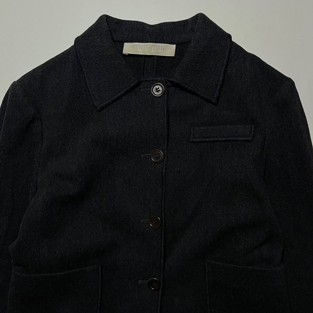 Vintage 90s Miu Miu Dark Gray Wool Jacket (Category: Luxury Apparel) located in Caloocan City. Submitted by achilles_grails (Listing ID 1471055699, Image 2). Description: - Brand: Miu Miu (Vintage 90s) - Color: Dark Gray - Material: Premium Wool (Made in Italy) - Size: IT 40 - Features: Classic collar, front button closure, front pockets - Condition: Excellent pre-loved vintage condition.