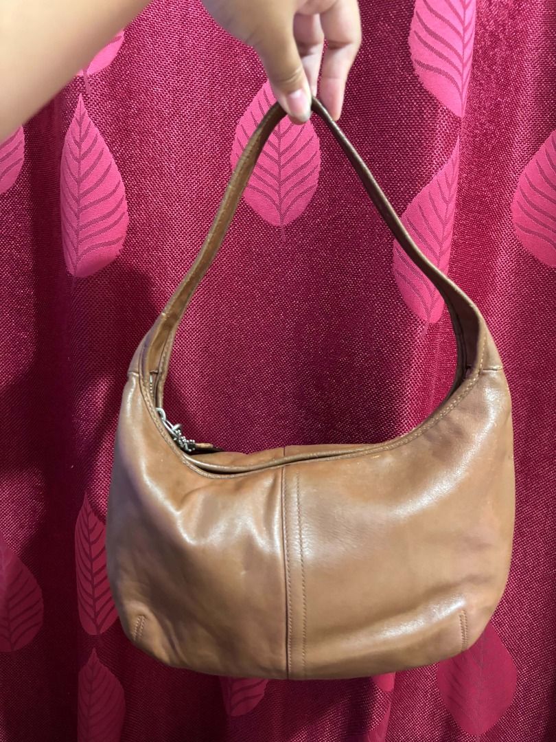 Vintage Coach Ergo Hobo Shoulder Bag (Category: Luxury Bags & Wallets) located in Taguig. Submitted by classicurations (Listing ID 1471024449, Image 2). Description: Authentic brown cowhide leather Coach hobo bag with silver hardware and a soft, slouchy shape. Features a secure zipper closure, matching leather hangtag, and a clean light blue fabric interior with the official creed patch (D0869-F12347)..