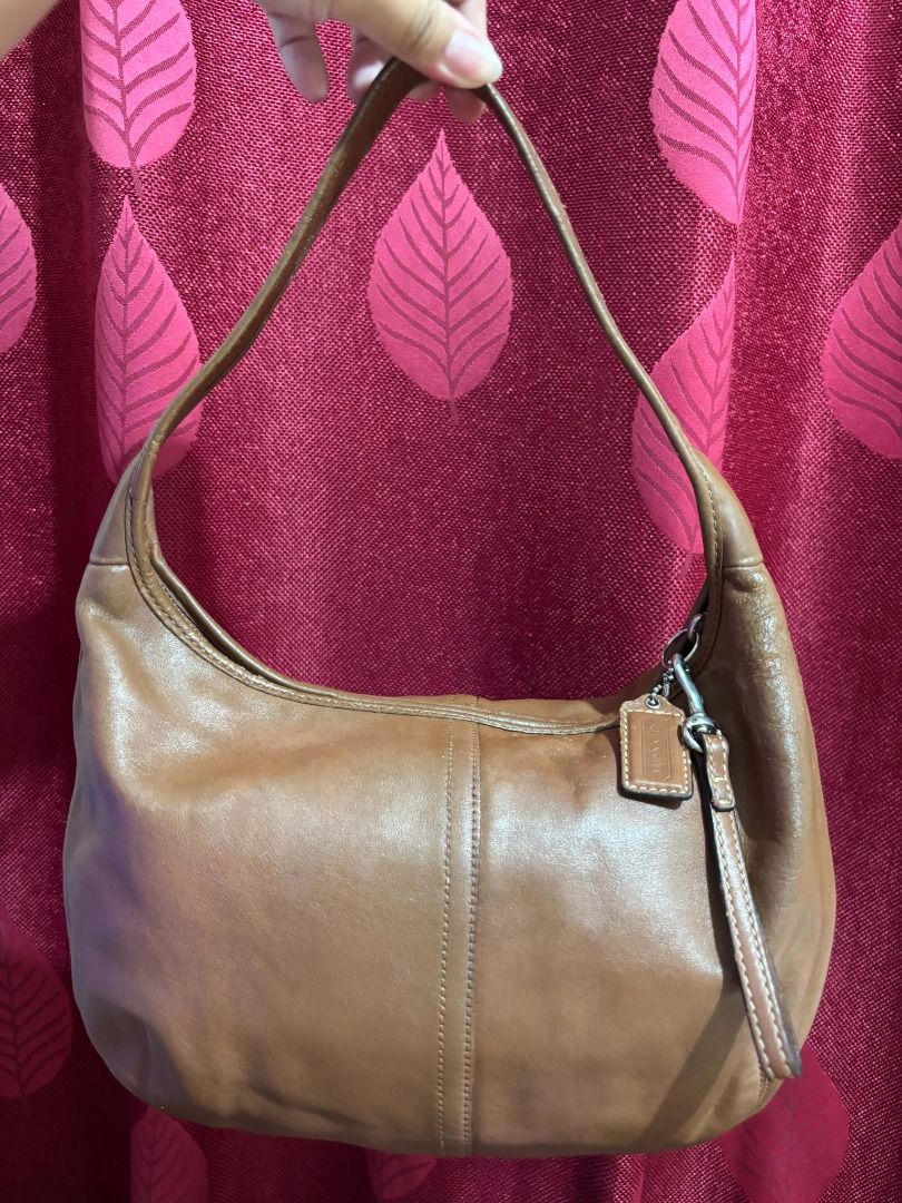 Vintage Coach Ergo Hobo Shoulder Bag (Category: Luxury Bags & Wallets) located in Taguig. Submitted by classicurations (Listing ID 1471024449, Image 1). Description: Authentic brown cowhide leather Coach hobo bag with silver hardware and a soft, slouchy shape. Features a secure zipper closure, matching leather hangtag, and a clean light blue fabric interior with the official creed patch (D0869-F12347)..