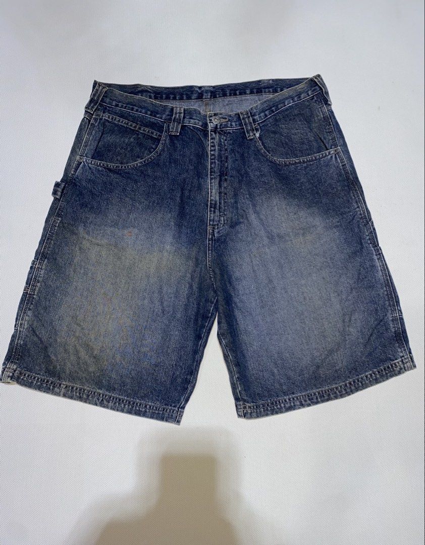 Vintage denim cargo shorts size 36 (Category: Shorts) located in Tagum. Submitted by waaap420 (Listing ID 1470963079, Image 1). Description: - Style: Blue denim cargo shorts with utility pockets - Size: 36 - Material: 100% cotton - Finish: Washed blue with natural fading and distressing - Closure: Button fly - Condition/Use: Practical for daily wear.