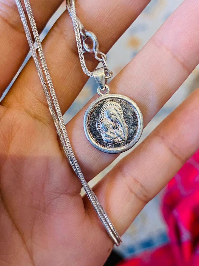 VINTAGE MARY & CHRIST SILVER NECKLACE (Category: Necklaces) located in Baguio. Submitted by asna_taku (Listing ID 1471016416, Image 3). Description: ✨ VINTAGE MARY & CHRIST SILVER NECKLACE ✨ A beautiful vintage religious necklace featuring a detailed medallion of Mother Mary and Baby Jesus, paired with an elegant silver-tone woven chain. A timeless piece symbolizing faith, love, and divine protection. 🤍🙏🏻 ✧ Vintage Piece ✧ Mother Mary & Baby J