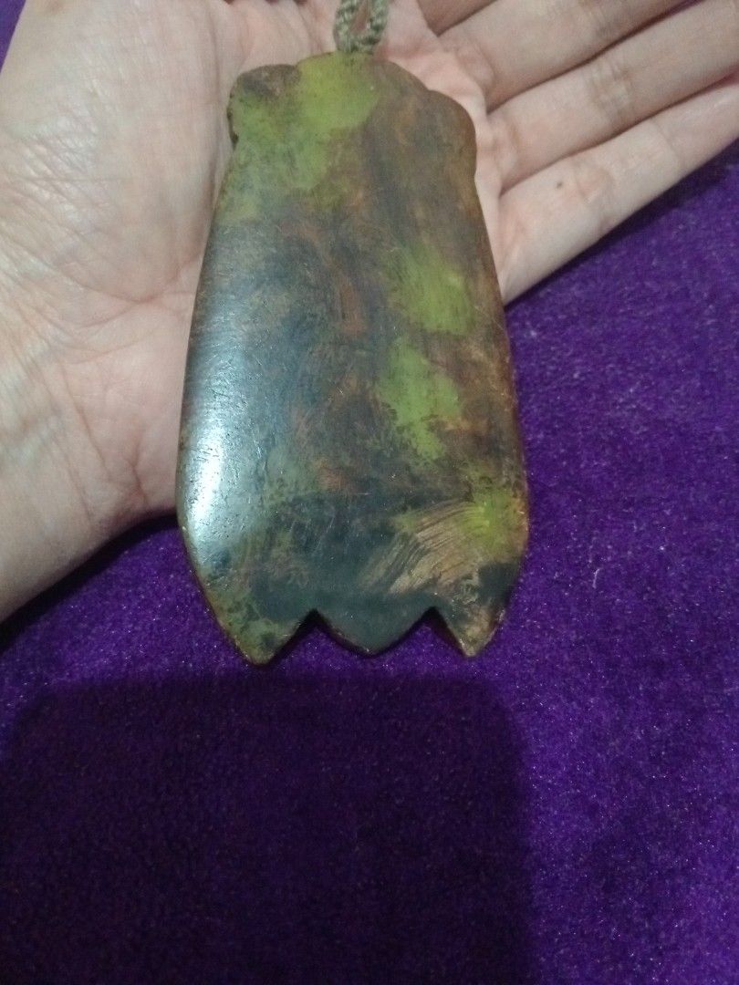 Vintage old jade cicada amulet with dzi agate (Category: Vintage Collectibles) located in Batangas. Submitted by girlmeetspurple (Listing ID 1471055094, Image 2). Description: This is a cicada-shaped pendant, a design deeply rooted in Chinese and Tibetan cultural traditions. The body is typically carved from jade or serpentine stone, inlaid with colorful stones — notably turquoise at the forehead — and features a Nine-Eye Dzi agate bead down the 