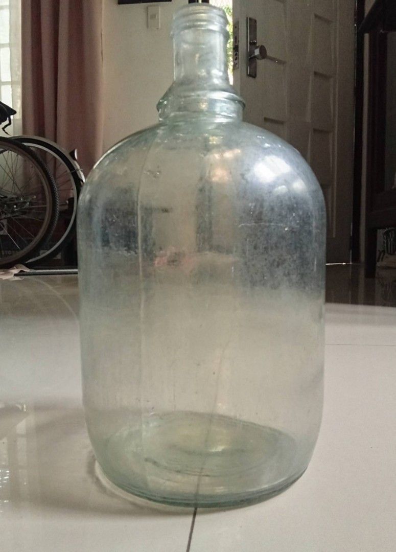 Vintage One-gallon Iridescent Clear Glass Loop Handle Jug, good condition Php900. (Category: Vintage Collectibles) located in Taytay. Submitted by abeatrice77985 (Listing ID 1471027489, Image 3). Description: Vintage One-gallon Iridescent Clear Glass Loop Handle Jug, good condition Php900..