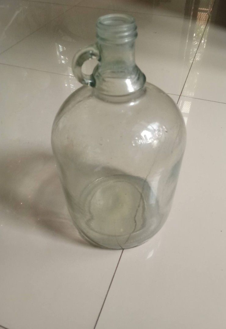 Vintage One-gallon Iridescent Clear Glass Loop Handle Jug, good condition Php900. (Category: Vintage Collectibles) located in Taytay. Submitted by abeatrice77985 (Listing ID 1471027489, Image 1). Description: Vintage One-gallon Iridescent Clear Glass Loop Handle Jug, good condition Php900..
