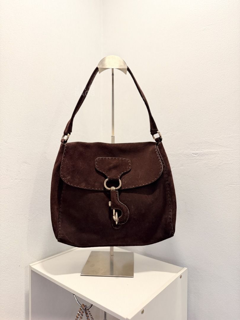 Vintage Prada Suede Shoulder Bag Brown (Category: Luxury Bags & Wallets) located in Paranaque City. Submitted by juliasmomsy (Listing ID 1470998116, Image 1). Description: Selling my pre-loved bags! :) - Authentic Vintage Prada Suede shoulder bag - SIZE: L:29 cm, H: 24 cm, W: 12 cm, Handle drop: 22 cm - COLOR: Classic dark brown - HARDWARE: Silver-tone hardware with secure clasp closure. With a triangle Prada logo on the side. - MATERIAL: Suede. 